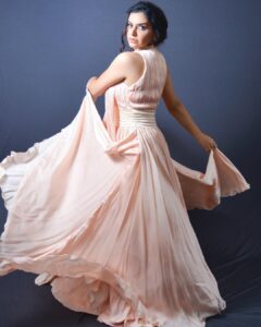 Nisha Bano Instagram - Dusty rose high neck low length flared culle sleeveless with pleats gown
Place your orders now