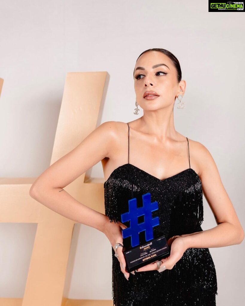 Nitibha Kaul Instagram - 🏆One for the books 🏆 Fashion Influencer of the Year (Editors Choice) at the @exhibitmagazine Influencer Awards 2023. Just so grateful for all the love & the support. Its moments like these that make the constant hard work & commitment that goes behind being an “influencer” truly worth it. It indeed is a 24*7 job, but I wouldn’t have it any other way ✨ Wearing @ashfaqueahmaddesignstudio Earrings @chanelofficial MUA @remtygarg_makeupartistry 📷 @sarv_eshhh #FashionInfluencerOfTheYear #AwardsNight #Influencer #NKNeverStops JW Marriott Goa