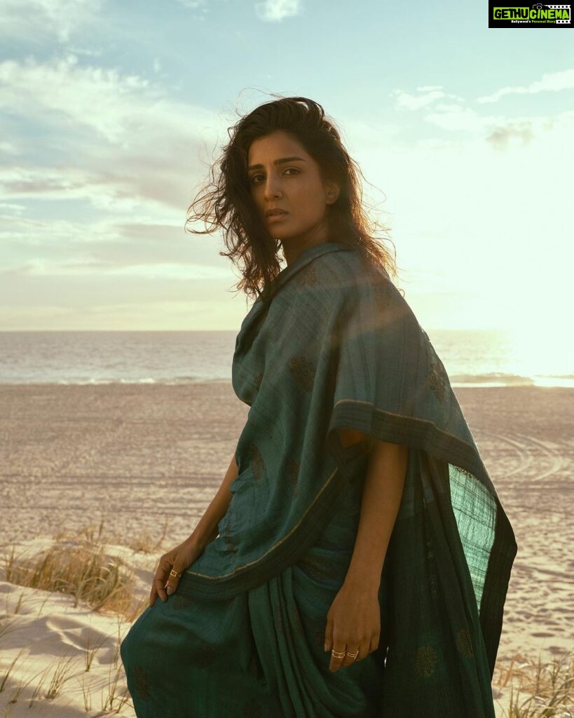 Pallavi Sharda Instagram - Sitting on the Meridian which holds the cusp of my ancestral past and futures, two cultures, two continents - wrapped in a sari I found in my mother’s closet that afternoon. Shot by @mauro_palmieri_photographer on the dunes of City Beach in WA on the sacred land of the Nyoongar people, on the Ocean my parents traversed to call this great southern land home. Sometimes the liminality of this land digs deeper than words can express. Yesterday was #nationalhandloomday. A moment - amongst many - to celebrate the artisans who weave the threads that envelope us in our histories. HMU @nadiaduca Camera Assist: @chrismartinstudio Sari: mama’s Jewels: @miromirostudio Indian Ocean