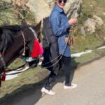 Puja Gupta Instagram - His name is Kallu - he is a young horse boy , we walked for 2 and a half hour non stop exploring Kashmir valleys and we became pals in just few minutes people in Kashmir asked me aren’t u afraid of a new horse u just met and u riding and taking him for walks My answer Animals are harmless they don’t scare me it’s only humans I’m more careful with in life :) 🐎 🌈 Gulmarg, Kashmir