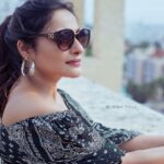 Rethika Srinivas Instagram – Style is a reflection of your attitude and your personality ✨ 

#rethikasrinivas #rethika #bright #smile #goodday #spreadlove #postivevibes  #confidence #elegance #love #moodygrams #gown #terrace #black #sunglasses