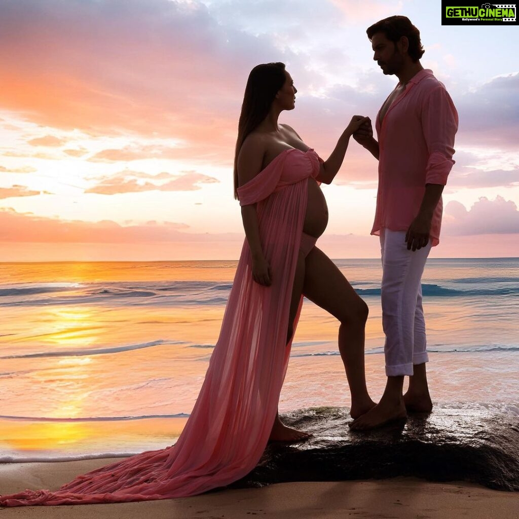 Rochelle Rao Instagram - We stood on this same beach 5 years ago and vowed to spend the rest of our lives together, today we watch the sun rise on the horizon as this new phase dawns in our lives. Our little blessing is on the way! This was honestly a surreal moment when our dear friends like Photographer @soondah_wamu and designer @anjkreations went above and beyond to help us create the perfect shot at our favourite spot! It was one of those moments when the reality and gravity of parenthood sunk in, and we just couldn’t be more grateful to all who made it possible. Special mention to @paloma_rao @divyapandurangam Nawaz & Sarah for all the help! And most importantly thank you to you our dear #instafamily for all the love you have showered on us, we are just overwhelmed!