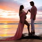 Rochelle Rao Instagram - We stood on this same beach 5 years ago and vowed to spend the rest of our lives together, today we watch the sun rise on the horizon as this new phase dawns in our lives. Our little blessing is on the way! This was honestly a surreal moment when our dear friends like Photographer @soondah_wamu and designer @anjkreations went above and beyond to help us create the perfect shot at our favourite spot! It was one of those moments when the reality and gravity of parenthood sunk in, and we just couldn’t be more grateful to all who made it possible. Special mention to @paloma_rao @divyapandurangam Nawaz & Sarah for all the help! And most importantly thank you to you our dear #instafamily for all the love you have showered on us, we are just overwhelmed!