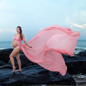 Rochelle Rao Instagram - We stood on this same beach 5 years ago and vowed to spend the rest of our lives together, today we watch the sun rise on the horizon as this new phase dawns in our lives. 
Our little blessing is on the way! 

This was honestly a surreal moment when our dear friends like Photographer @soondah_wamu and designer @anjkreations went above and beyond to help us create the perfect shot at our favourite spot! 

It was one of those moments when the reality and gravity of parenthood sunk in, and we just couldn’t be more grateful to all who made it possible.

Special mention to @paloma_rao @divyapandurangam Nawaz & Sarah for all the help!

And most importantly thank you to you our dear #instafamily for all the love you have showered on us, we are just overwhelmed!