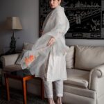 Sagarika Ghatge Instagram - | DIYA | This gorgeous set of white chanderi kurta and ankle length pants in cotton is paired with a hand painted organza silk dupatta with delicate orange floral motifs. @akuteebysagarika Shop the look on www.akutee.co.in (link in bio) Photographer: @sprinkledwords . . . . . #AkuteeBySagarika #WomenOfAkutee #AkuteeClassics #Festive #Ethnic #Traditional #ChanderiKurta #HandPainted #Elegant #IndianWear #TimelessClassics #SagarikaGhatge #KurtaSet #ChanderiSilk #OccasionWear #WhiteKurta #Style #MadeInIndia #OrganzaSilk #OrganzaDupatta #Floral