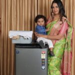 Sanjjanaa Instagram - It was such a proud and special moment for me to be shooting for @voltasbeko washing with my family … machine by #tata brand , thank you to all the people who have sent me applause on all my platforms as this ad has gone live everywhere featuring me my husband dr.azeez pasha & my baby @princealarik - thank you for all the love. You have showered on us. @sanjjanaagalrani Beautiful saree @iyra_designstudio Hair @hair_artist_ramyagowda Make up @divyamakeupartistofficial Karnataka, Bangalore
