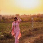 Sharanya Turadi Instagram - Some beautiful paths can’t be discovered without getting lost ,they say, ain’t that the truth? 🫶✨ Man behind the lens @rahul__sudharshan , caught a slice of my day so raw and beautifully! Walking through our little piece of farmland by the sunset . We had to attend a wedding in a village later that day so I had to pick a salwar suit little festive yet subtle and that was when this peach suit I picked from @tada_wearhouse came to my rescue! To more sunsets and beautiful memories ❤️