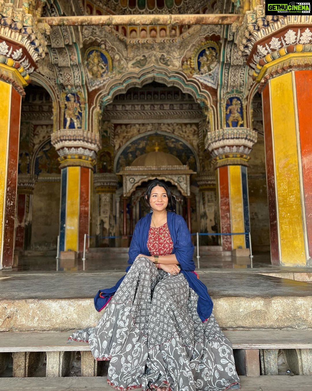 Sharanya Turadi Instagram - Frames of Thanjavur ❤️ 1. The colourful darbar of King Sarabhoji 2. The super cute elephant, ‘Mangalam’ from Kumbeshwarar temple, kumbakonam 3. The artistic view of Tanjavur palace 4. The famous filter coffee of Mangalambikai mess 5. My lifeline gang 6. The brass statue of Shiva and Parvathy from Chola period 7. The relaxing view of Tanjavuru mannu just before summer rains 8. This beautiful dome standing alone I found at Adikumbeshwarar temple with intricate colours painted inside 9. Me trying hard not to laugh while my whole gang is standing at the other side of the camera 😝 #kumbakonam #thanjavur #templesofsouthindia #mangalambikamess #thanjavurpalace #summerrains #historyisbeautiful Thanjur