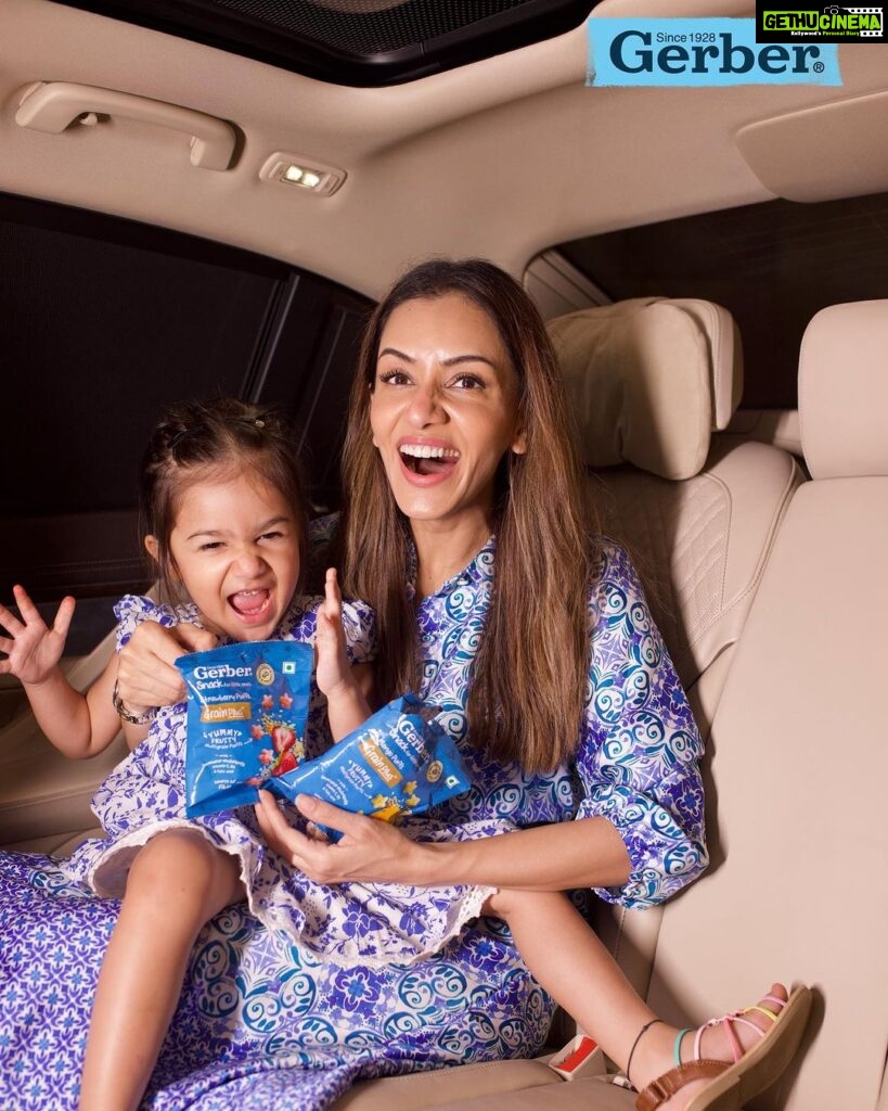 Smriti Khanna Instagram - Road trip essentials for our family? GERBER Puffs all the way! 🚗 Snack time just got an upgrade for our adventure-packed journey. GERBER Puffs are a win-win – fruity and delicious + a source of fiber - making me and Anayka 🤩 Made with multigrains like oats, wheat & rice, they're the perfect crunchy and nutritious treat for our little explorers. 🌾 Get ready to snack smart on the road and Grab your GERBER Puffs today! Proud member of the #TheVillagebyGERBER Disclaimer: This picture was clicked before starting the trip. Kindly ensure seat belt is fastened while the vehicle is moving #gerberpuffs #gerbersnacks #anythingforlittleones #Gerber #GerberIndia #thevillage#thevillagebyGerber