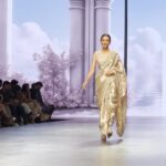 Smriti Khanna Instagram – What a day! What a show! And what an absolute honour to be walking for the @lakmefashionwk x @tatwammcouture 

This collection by TATWAMM, named ‘Sobo Sassy’, is dedicated to the confident sassy girl, who is ‘Sobo’- in Search of Better Option.

The collection blends traditional Indian craftsmanship with the spirit of the modern era. Today’s women are bold, self-assured, and fiercely individualistic. They embrace their Indian heritage but rewrite the narrative with their unique style choices.

The fabrics used in the collection are hand woven tissues and brocades with the best of hand embroidery,  which preserves the essence of ‘Tatwamm’. Age old techniques of zardosi and marodi have been used with a play of pearls, sequins and the traditional salma dabka.

In “Sobo Sassy,” tradition and modernity converge in a spectacular display of artistic expression. This collection is a tribute to women who forge their own paths, unapologetically rewriting the script of Indian ethnic wear. It’s a testament to the ever-evolving, empowered women of today. Pragati Maidan Delhi