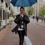 Sonakshi Sinha Instagram - Found a hands free way to carry my umbrella… Style bhi… suvidha bhi 😎 #Amsterdam #rainyday #umbrella #reelsinstagram