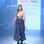 Aahana Kumra Instagram - Runway ready and feeling like superwoman💯🫡💪 Proud and humbled to be the showstoppper for @whistling_woods design students for @bombaytimes fashion week ! My 5th consecutive year at the #bombaytimesfashionweek and this time it was for my Alma Mater! A huge congratualtions to all the students who participated and much love to you @meghnaghaipuri_official @rahul77 and @jewellynalvares for believing in me always 💕🌸🫶👯‍♀️ @timesfashionweek Styling : @juhi.ali Make up : @komzy_le Hair : @kahkashaaaan Photos : @prathameshb84 @karanhenry @anujmalkanphotography Jewellery : @shopeurumme @rubans.in Shoes : @oceedeeshoes Managed by : @suchijaggi @itsbhavyapatel_ #showstopper #fashionweek . . . . #bomabytimes #fashionshow #fashion #design #aahanakumra #blingiton #mumbai #goshowstopper St. Regis Hotel