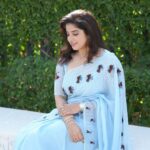 Aima Rosmy Sebastian Instagram - AAMBAL Draped in the enchanting allure of a Water Lily, this exquisite saree, skillfully crafted by @tazzels3 💙 Clicks by @vineethphotos 📸 Muweillah Comercial, Sharjah UAE