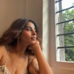 Anisha Victor Instagram - I love looking out of the window… I could do it for hours.. and it may seem like a colossal waste of time to many but it brings me peace. A short meaningful pause in the chaos of the city( same AQI but still helps). I’m running at hundred miles per hour… okay not literally 100 miles/hour but you get the picture. The path is uneven, might even hit my toe against a rock sticking out of the ground, the coconut just about hanging on to its last fibre misses you by a second or maybe not, a gust of wind brings with it some sand ready to make my eye a temporary habitat (and if it has to be… let it be my left eye God! I use the right one to shoot). The little insect aims straight for the eyes or the nose or the mouth and that’s my first meal of the day. The little pebble… a teeny tiny microscopic pebble in my shoe! Do not underestimate it. You know the feeling right! It’s not exactly an itch you can’t scratch…you can take off your shoe and ….well just scratch your foot and take the invincible pebble out but wouldn’t it be nice to go just one day without that happening. The crow pooped on my shirt but I’m still running because at least it didn’t get my hair this time, no reason for me to stop now when some detergent and water can take care of it later. And of course you’re going to encounter a curve ball… and I’m not taking metaphorically here;an actual curve ball. Well, what was I expecting…I’m on a track in a Cricket field. But I keep running. I see my smartwatch and I stop to quench my thirst. Luckily I have a bottle of sweet sweet water on me. Now back to running again…and if you still think it’s about running… The water bottle is the window. 🪟 Fin. Bandra West