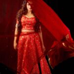 Anjana Rangan Instagram - Day 3 : Red ♥️💥 The colour of Power, strength and Courage. She is Fierce when she loves. When she fights. When she wins! She is Red ❤️‍🔥 #navarathricollections by @magicbyjeeni Shot by @padambyveni MUAH : @kalai_hair_and_makeup ✨