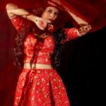 Anjana Rangan Instagram - Day 3 : Red ♥️💥 The colour of Power, strength and Courage. She is Fierce when she loves. When she fights. When she wins! She is Red ❤️‍🔥 #navarathricollections by @magicbyjeeni Shot by @padambyveni MUAH : @kalai_hair_and_makeup ✨
