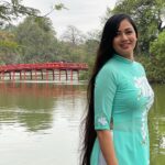 Archita Sahu Instagram - Many of you asked what I was wearing in last few posts . That’s ‘Ao dai’ . It’s the Vietnamese dress basically a silk tunic with straight pants . I got to know about it while talking to few locals who helped me with the shop address too to buy from. And here I am with few newly made local friends ❤️ NB : last pic shows my touristy mode 😂 #aodai #hoankiem #cafe #SabyArchita #archita #travel #road #rickshaw #bus #cafehoankiem #highlandcoffee