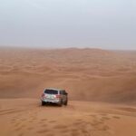 Daksha Nagarkar Instagram - Let me take you to watch sunrise in a desert 1) all set to go 2) arrived at the beautiful red sand desert 3)awaiting sunrise and also some psychedelic 4)since there was a mini sand storm it was a struggle to get to the top. Ps: never wear socks in sand 5)the calm after the storm 6)me vibing to the song in my head 🙈 7)joined by some racers, it’s insane to race in sand, loved it 8)it was time to go before the second storm hit us 9) felt cute 10) I will come back . . #dakshanagarkar #love #happy #desert #racing #sunrise #safari #adventure #instagram #pictureoftheday #instagood #travel #travelphotography #fun #girl