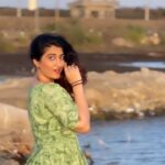 Denisha Ghumra Instagram - Having fun with the wind, hair and not so tanha tanha, Because Tanha Tanha yahan pe jeena, yeh koi baat hai! . Captured - The reason i am not Tanha @shastribalraj 🤣❤️ . Oh and also flaunting this one piece i made for myself 💚 . #rangeela #tanhatanha #dancingreels #dancereelsindia #denishaghumra #bediport_jamnagar #jamnagar_instagram #reelkarofeelkaro Bedi Port , Jamnagar