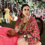 Gul Panag Instagram - The phulkari is such an integral part of our culture. From all things auspicious to all things festive -the phulkari is always there. Either as the main act. Or the supporting one, where we simply carry it on our forearms ( in addition to the full outfit and its own dupatta). At every wedding, shagan, engagement and jaago- the phulkari will ALWAYS make an appearance. Here I’m wearing a bagh ( all over embroidery) from @1469original . Occasion is Vatana. And my outfit is borrowed from @simranpotnis - we’ve decided to have all our clothes in JV now. 😅 Blue sari is @ritukumarhq . From 1999. Qualifies as vintage I suppose Also, managed to get HIM to pose for a picture.😅 @keeratkular thanks for the photos. And for reminding me that the knot clutch exists in my wardrobe. And of course for EVERYTHING else.😂 P.S Phulkari (ਫੁਲਕਾਰੀ) refers to the folk embroidery of the Punjab. Although Phulkari means floral work, the designs include not only flowers but also cover motifs and geometrical shapes. Incidentally, culturally prevalent in Punjab, Pakistan too.