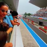 Gul Panag Instagram - Seeing the race through Nihal’s eyes was fun. He’s been a regular at the @buddh.international.circuit for a few years, now courtesy , his Mom’s jury duty on @ackodrive and before that on @carandbike and of course his uncle Sid @sidpatankar . But this was his first time at an actual race. I wasn’t sure if he’d last . 😅 I thought he may get bored, and the crowd can be quite overwhelming . And then there was the noise. Music to some of us, but it is still pretty high decibel sound. ( As the Husband captured on his @apple watch- last video ) He took to it like fish to water. Stood in the balcony, watching two complete races ( Moto GP and Moto 2) as sweat, dripped from his face and drenched his shirt . It WAS pretty humid. And sunny. Yes, I think he is a motorsport fan in the making .🥰 And he was quite cognisant of Marco Bezzecchi’s considerable lead from early in in the race. And kept asking if No 72 was going to win!! @motogpbharat @buddh.international.circuit @motogp #motorsport #motogp #motogpbharat Buddh International Circuit