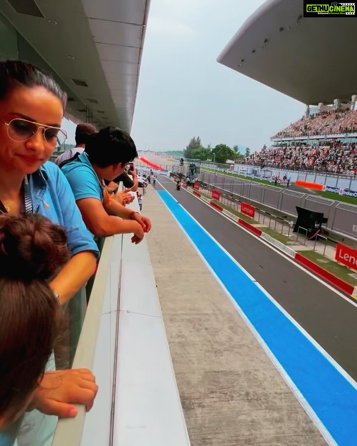 Gul Panag Instagram - Seeing the race through Nihal’s eyes was fun. He’s been a regular at the @buddh.international.circuit for a few years, now courtesy , his Mom’s jury duty on @ackodrive and before that on @carandbike and of course his uncle Sid @sidpatankar . But this was his first time at an actual race. I wasn’t sure if he’d last . 😅 I thought he may get bored, and the crowd can be quite overwhelming . And then there was the noise. Music to some of us, but it is still pretty high decibel sound. ( As the Husband captured on his @apple watch- last video ) He took to it like fish to water. Stood in the balcony, watching two complete races ( Moto GP and Moto 2) as sweat, dripped from his face and drenched his shirt . It WAS pretty humid. And sunny. Yes, I think he is a motorsport fan in the making .🥰 And he was quite cognisant of Marco Bezzecchi’s considerable lead from early in in the race. And kept asking if No 72 was going to win!! @motogpbharat @buddh.international.circuit @motogp #motorsport #motogp #motogpbharat Buddh International Circuit