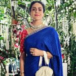 Gul Panag Instagram - The phulkari is such an integral part of our culture. From all things auspicious to all things festive -the phulkari is always there. Either as the main act. Or the supporting one, where we simply carry it on our forearms ( in addition to the full outfit and its own dupatta). At every wedding, shagan, engagement and jaago- the phulkari will ALWAYS make an appearance. Here I’m wearing a bagh ( all over embroidery) from @1469original . Occasion is Vatana. And my outfit is borrowed from @simranpotnis - we’ve decided to have all our clothes in JV now. 😅 Blue sari is @ritukumarhq . From 1999. Qualifies as vintage I suppose Also, managed to get HIM to pose for a picture.😅 @keeratkular thanks for the photos. And for reminding me that the knot clutch exists in my wardrobe. And of course for EVERYTHING else.😂 P.S Phulkari (ਫੁਲਕਾਰੀ) refers to the folk embroidery of the Punjab. Although Phulkari means floral work, the designs include not only flowers but also cover motifs and geometrical shapes. Incidentally, culturally prevalent in Punjab, Pakistan too.