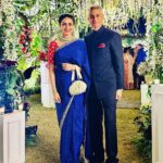 Gul Panag Instagram - The phulkari is such an integral part of our culture. From all things auspicious to all things festive -the phulkari is always there. Either as the main act. Or the supporting one, where we simply carry it on our forearms ( in addition to the full outfit and its own dupatta). At every wedding, shagan, engagement and jaago- the phulkari will ALWAYS make an appearance. Here I’m wearing a bagh ( all over embroidery) from @1469original . Occasion is Vatana. And my outfit is borrowed from @simranpotnis - we’ve decided to have all our clothes in JV now. 😅 Blue sari is @ritukumarhq . From 1999. Qualifies as vintage I suppose Also, managed to get HIM to pose for a picture.😅 @keeratkular thanks for the photos. And for reminding me that the knot clutch exists in my wardrobe. And of course for EVERYTHING else.😂 P.S Phulkari (ਫੁਲਕਾਰੀ) refers to the folk embroidery of the Punjab. Although Phulkari means floral work, the designs include not only flowers but also cover motifs and geometrical shapes. Incidentally, culturally prevalent in Punjab, Pakistan too.