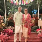 Gul Panag Instagram - The phulkari is such an integral part of our culture. From all things auspicious to all things festive -the phulkari is always there. Either as the main act. Or the supporting one, where we simply carry it on our forearms ( in addition to the full outfit and its own dupatta). At every wedding, shagan, engagement and jaago- the phulkari will ALWAYS make an appearance. Here I’m wearing a bagh ( all over embroidery) from @1469original . Occasion is Vatana. And my outfit is borrowed from @simranpotnis - we’ve decided to have all our clothes in JV now. 😅 Blue sari is @ritukumarhq . From 1999. Qualifies as vintage I suppose Also, managed to get HIM to pose for a picture.😅 @keeratkular thanks for the photos. And for reminding me that the knot clutch exists in my wardrobe. And of course for EVERYTHING else.😂 P.S Phulkari (ਫੁਲਕਾਰੀ) refers to the folk embroidery of the Punjab. Although Phulkari means floral work, the designs include not only flowers but also cover motifs and geometrical shapes. Incidentally, culturally prevalent in Punjab, Pakistan too.