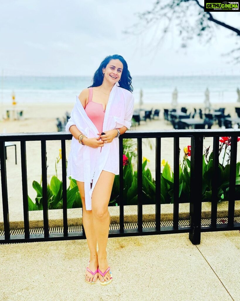 Gul Panag Instagram - Pool and beach vibes only.🤩 This trip, I rested the beginning to become fragile black and white @marksandspencer swimsuit. But I want want to take this opportunity to introduce you to two new ones- ( since I had so many queries on my stories). I believe a swimsuit should be comfortable, practical, durable and very flattering. 😅 So here’s a bit about these. Photo 1 is another trusted @marksandspencerindia suit. Durable. I have had it for about 5 years now. The neck strap is beginning to lose a bit of elasticity, but is adjustable so easy fix. Photo 2 is the new @ripcurl full sleeves suit I got recently. I end up spending a lot of time in the pool with Nihal. And often my shoulders and arms get badly burnt no matter how much sunscreen I apply. And this seems like a really good alternative. Not sure how durable it will be. It’s made a very fine, thin material almost like a pair of stockings. Photo 3 features a pink one , Roxy, that is also fairly new. (Got it last year here in Phuket. At the airport. There’s a great store that sells Quicksilver, Roxy and billabong in the arrival hall by the baggage belts.) It has Excellent stretch. And is very comfortable. The wrap is a really comfortable @Zara shirt I got some years ago. Photo 4 has the same swimsuit from photo 1 , but with a very nice wrap I picked up here, at the hotel on this trip. Nice flattering wraps are hard to come by / and this one is a particularly good one. For those of you who read through all of this, let me know if there are more queries you have, and I will answer them in the comments. Thanks for reading .❤️ Phuket, Thailand