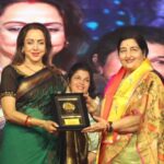 Hema Malini Instagram - At the Utsav yday. Lilting bhajans beautifully and soulfully rendered by Anuradha Paudwal. The public enjoying the varieties offered in the festival - the exclusive shops, the lovely sculptures kept for sale, the excellent food shops offering huge variety of yummy eats - name it, the mela has them all! People thronging from nearby Delhi, Agra, Lucknow etc to partake in this 10 day festival of art and culture. Mathura welcomes you all🙏 #brajrajutsav #anuradhapaudwal #braj