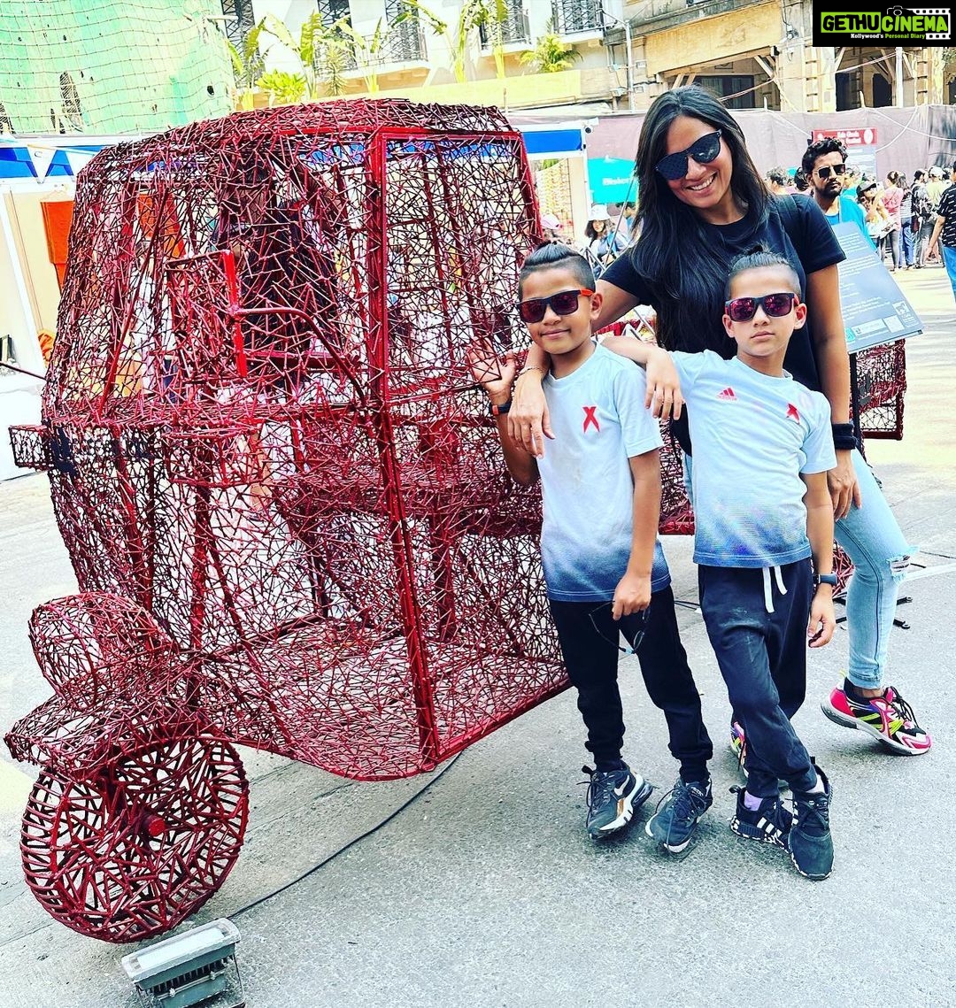 Kanchi Kaul Instagram - This February Sunday is a permanent mark on our calendars, every year!!! The atmosphere of seeing so many artists come together to present some really cool , beautiful , out of the box art installations in the most historic part of the city on the roads, out in the open , is always a pleasure and this year was no different. Pepsi cola for 50 paise outside school was my version of junk joy in my childhood. Never would it have crossed my mind that I would repeat that with my boys decades later and enjoy it even better 😀 This years theme was “ past forward” and of course had a lot to do with sustainability . To get into somebody else’s mindset into creating an art piece is an amazing journey and learning in itself. Something every child, every human should be exposed to. The childrens museum had some wonderful art exhibits put up by various schools around the city , all put in their collective , artistic and sustainable efforts for everyone to experience . Sitting in the open , listening to stories, surrounded by other kids, grasping it all in ❤️🔥 Walking through a museum with stuffed animals , used for research and study, we learnt so many new things including that this art is called #taxidermy . The day ended with a carnival at the derby. The beautiful sport of horse racing, (thank you dad 💖) learning about horses , their behaviours, their track records,how they train, and show off that insane horse power, so majestically. Just marvellous!!!! Although all exhibits were outstanding , Slide 7 really resonated with us …. Footwear is something constant throughout our life journey just like lifes highs and lows . coming down the slide is always a joyous moment, so in life’s journey, even when we go through the low phases , let us feel like we’re going down the slide and enjoy even that so that we learn some thing out of the experience and come out better from it “सुख” so much to be thankful for, always! #onelife #happydays #makethemostofit #peace #explore #art #artfestival #kalaghoda #derby #horseracing #carnival #theadventuresofAI #neveradullmoment #thebeautyofeverything #gadgetfreechildhood #grateful