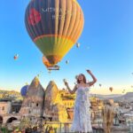 Kritika Sharma Instagram – The most favourite part of my turkey trip to do this 🤍 #gratitude 
Outfit @sainygargcouture 
Styled by @_vaishnavii.3011 
Location @sultan_cave_suites 

#travel #whitedress #cappadocia #hotairballoon #photoshoot #terrace Sultan Cave Suites