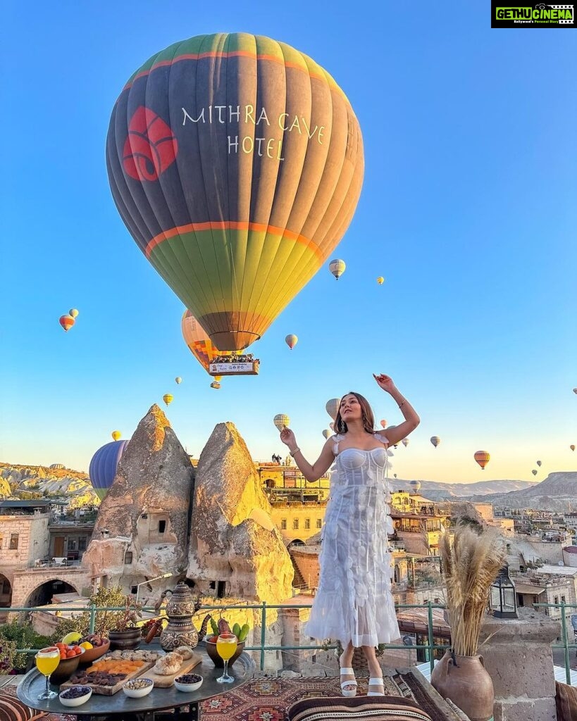 Kritika Sharma Instagram - The most favourite part of my turkey trip to do this 🤍 #gratitude Outfit @sainygargcouture Styled by @_vaishnavii.3011 Location @sultan_cave_suites #travel #whitedress #cappadocia #hotairballoon #photoshoot #terrace Sultan Cave Suites