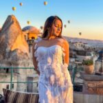 Kritika Sharma Instagram – The most favourite part of my turkey trip to do this 🤍 #gratitude 
Outfit @sainygargcouture 
Styled by @_vaishnavii.3011 
Location @sultan_cave_suites 

#travel #whitedress #cappadocia #hotairballoon #photoshoot #terrace Sultan Cave Suites