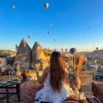 Kritika Sharma Instagram – The most favourite part of my turkey trip to do this 🤍 #gratitude 
Outfit @sainygargcouture 
Styled by @_vaishnavii.3011 
Location @sultan_cave_suites 

#travel #whitedress #cappadocia #hotairballoon #photoshoot #terrace Sultan Cave Suites