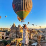 Kritika Sharma Instagram – The most favourite part of my turkey trip to do this 🤍 #gratitude 
Outfit @sainygargcouture 
Styled by @_vaishnavii.3011 
Location @sultan_cave_suites 

#travel #whitedress #cappadocia #hotairballoon #photoshoot #terrace Sultan Cave Suites