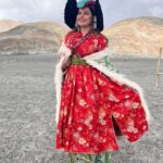 Madhu Sharma Instagram – Ladakhi traditional dress

Goncha or Kos or Sulma are the main dress worn by all the communities in Ladakh by both the sexes, accompanied with a colourful sash tied around their waist. The women’s robe, however, flares downwards with small pleats accentuating it into a flowy gown.Goncha or Kos is a voluminous robe resembling a coat made of wool, velvet, cotton, polyester, or a combination of these. Pangong Tso