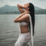 Malavika Mohanan Instagram - The idea of a far far away time has always fascinated me. A simpler time. A purer time. Romanticised thought? Probably. But then I’ve always had a fascination for a utopian scenery. A time when everything was simpler, purer. Raw. Away from the garbs and ornaments, and clutter and noise. Just water and white. 🤍 Shoutout to this incredible team for a shoot where they literally had to get their hands and feet dirty 🤍😅 Thank you for making what was in my head come to life to gracefully 🤍 📸 @bharat_rawail Makeup @makeupbylekha ; Assisted by @makeupartistraga Hair @bbhiral ; Assisted by @prashantkharadi_lalit Styled by @radhikaa2327 @theitembomb