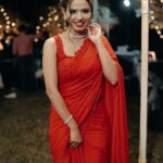 Meenakshi Raveendran Instagram - Pigalle scarlet Designer saree by @tiana_designers 📸 @jishnumurali_