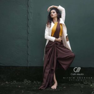 Meenakshi Raveendran Instagram - Kick the pleats of sheer elegance

Mua @makeover_by_mufeee 

Concept and styling @amruthaappu @amal_gop 

Costume @vogue_designer_studio
@zelah.and.i 

Costume assist @apolloblithe

Photo @maplestories__ 
@cathmediastories 
@nithinsundher_photography

Cinematography @the_oceaneyes_studio
@_dytr_