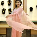 Meenakshi Raveendran Instagram - "The pink that twirls the world " Dearest @meenakshi.raveendran in a shade of pink from @dakshabridalcouture Stylist: @_the__brown__boy #boutique #fashion #style #boutiqueshopping #onlineboutique #fashionista #fashionstyle #dress #boutiquefashion #boutiquestyle #clothing #clothes #bridalcouture #dakshabridalcouture