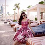 Mouni Roy Instagram - Thank you @QatarAirways @HIA @BagatelleBeachClubDoha @Formula1 for a lovely day Outfit @dolcegabbana 📸 @iamvish_photographer