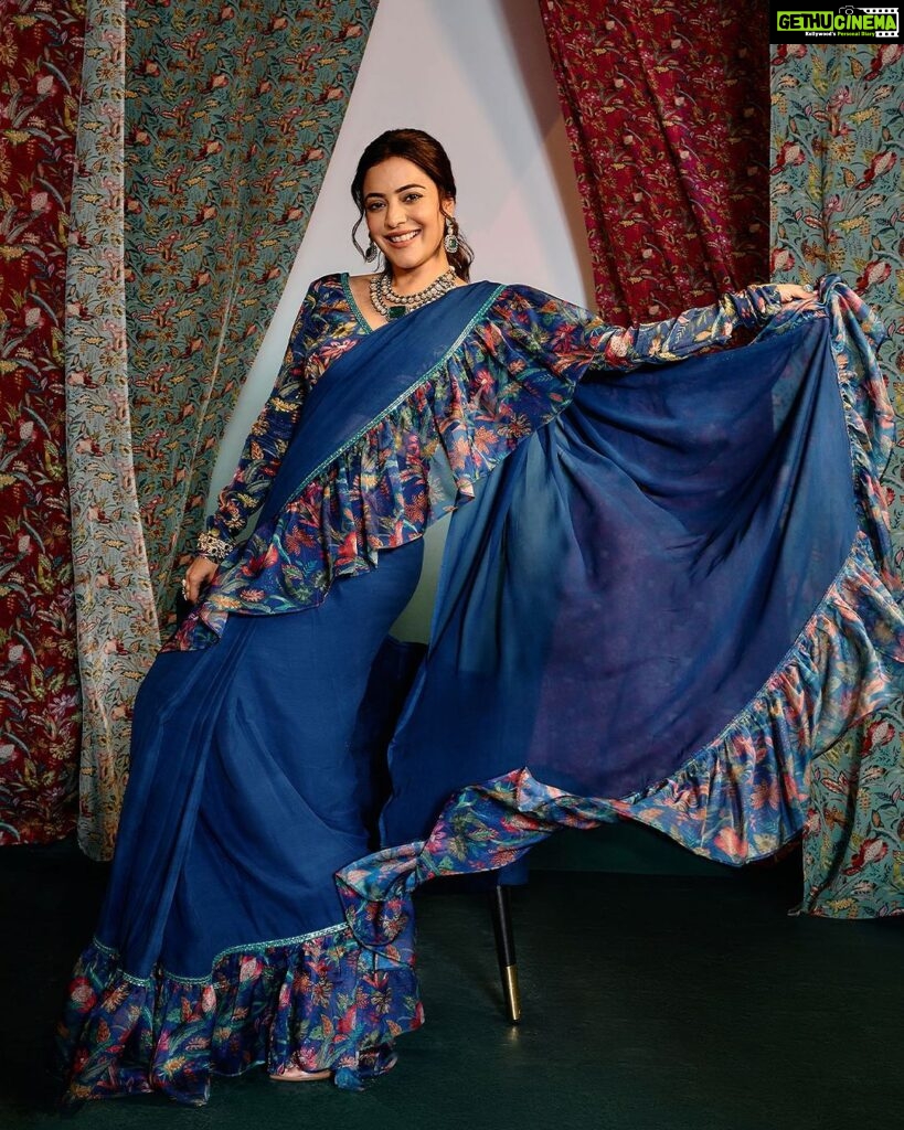 Nisha Agarwal Instagram - Introducing @nishaaggarwal in @rishiandvibhuti for Gajra Gang collection. ✨ Adorning our blue ruffle frill saree crafted in signature prints and delicate lace appliqué, perfect for the festive season. 🔎 Search the code GGRVSAR01 on Nykaa Fashion to shop. 🛒www.nykaafashion.com Exclusively available on Nykaa Fashion. Express Shipping Available. #GajraGang #RishiAndVibhuti #NykaaFashion #Nykaa #JanhviKapoor #Tyohar #NewArrivals #Indianwear #FestiveStyles #FestiveCollection #Diwali #Fashion #Explore #Trending