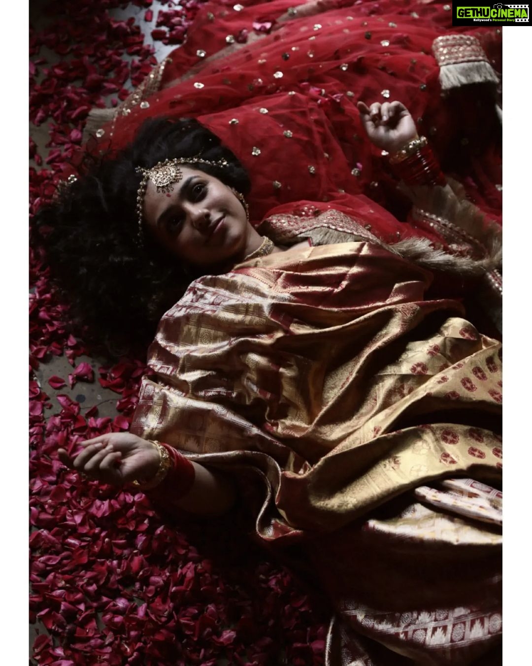 Nithya Menen Instagram - On this auspicious occasion of Navaratri - This is inspired from a vintage painting from India depicting a woman in red saree. The Divine Feminine - Goddess Durga is considered to be the physical form of ‘Shakti’ or ‘Universal Energy’. She was created by the Hindu Gods to annihilate the notorious demon ‘Mahisasura’. Reimagine is an attempt at creating a fresh look and feel about a character and spinning a new story out of them. But all are re-interpretations with an intriguing approach, while retaining the visual essence of the original works. Creative direction and styling, make up done by @rishabhad Photography done by @sauvicksengupta Clothes @jayshree_studios Jewelry @tahir_somethingsopure
