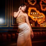 Niyati Fatnani Instagram - Vibe...💫🍷 Styled by: @styleitupbyaashna Shot by: @mirajverma_photography Corset: @labelmuslin Skirt: @creativefashion_by_himani Earrings: @nishka.closet_ Hair & Makeup by: @celebsmakeupbysejal @makeoverbysejalthakkar Location: @lotdpowai #gold #niyatifatnani #styleitupbyaashna