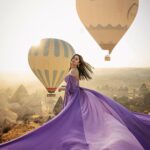 Nupur Sanon Instagram - She is stillness in a world of chaos💜💛🌈 • 📸 : @arik_photoart @cappadocia_photoart 👗: @dressdociaofficial Cappadocia