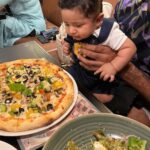 Pooja Ramachandran Instagram - Our first pizza date lunch with @kiaankokken The day is not far away when Kiaan starts eating our favourite with us sooooon!! Kiaan’s first mall visit. :) #lafamilia #familytime #pizzalovers #lovemyfamily #treatday #sourdoughpizzas #kiaankokken #babysdayout