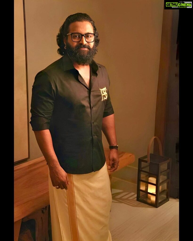 Rishab Shetty Instagram - Timeless fusion – Here we embrace the elegance of a black shirt with the traditional charm. Classic meets contemporary in this ensemble of contrasts. Styled by @pragathirishabshetty #houseofpragathishetty #siima2023 #kantara