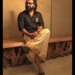 Rishab Shetty Instagram - Timeless fusion – Here we embrace the elegance of a black shirt with the traditional charm. Classic meets contemporary in this ensemble of contrasts. Styled by @pragathirishabshetty #houseofpragathishetty #siima2023 #kantara